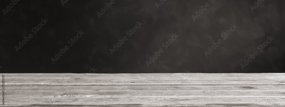 background with white wooden table and dark wall background with white wooden table and dark wall