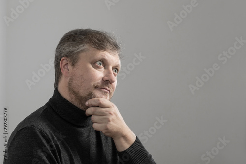 Fototapeta Naklejka Na Ścianę i Meble -  mature man with beard on gray background