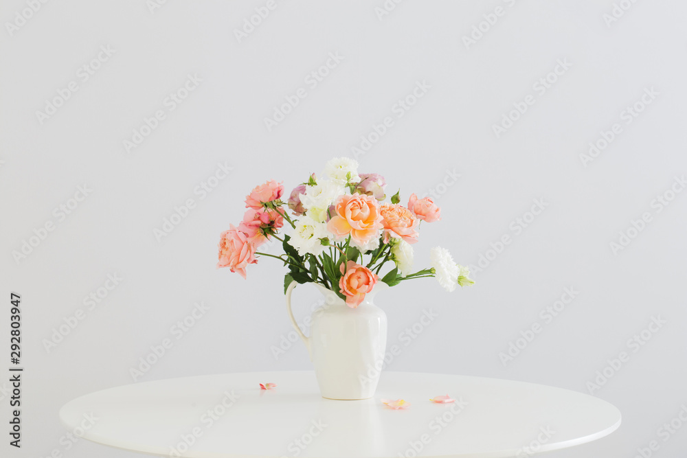 beautiful roses in ceramic white jug beautiful roses in ceramic white jug
