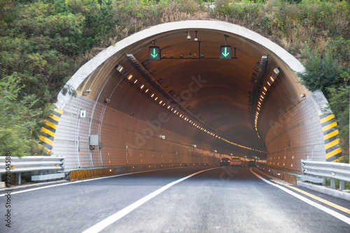 Entrance to a country road tunnel photo