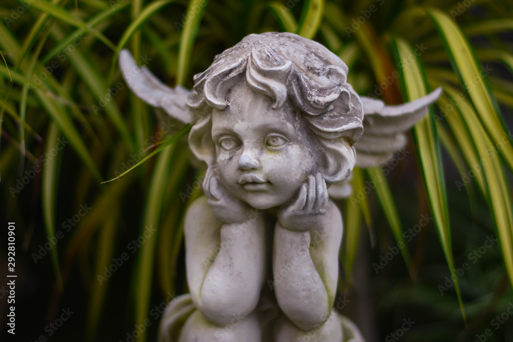 Stucco doll, Cupid, the god of conveying love in Western beliefs Stucco doll, Cupid, the god of conveying love in Western beliefs