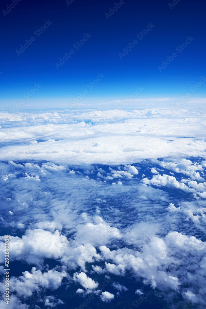 Shooting from the plane. Flying above the clouds. Vertical frame Shooting from the plane. Flying above the clouds. Vertical frame