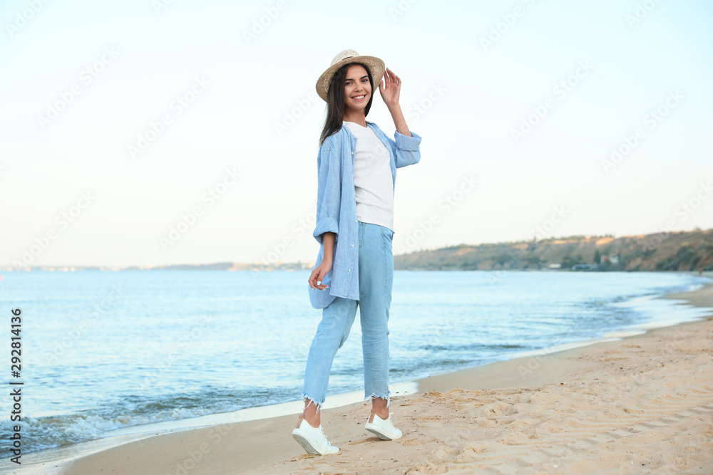 Beautiful young woman in casual outfit on beach Beautiful young woman in casual outfit on beach