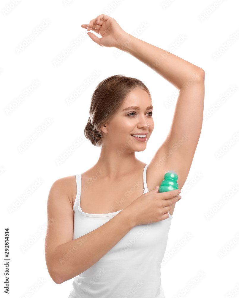 Young woman applying deodorant to armpit on white background Young woman applying deodorant to armpit on white background