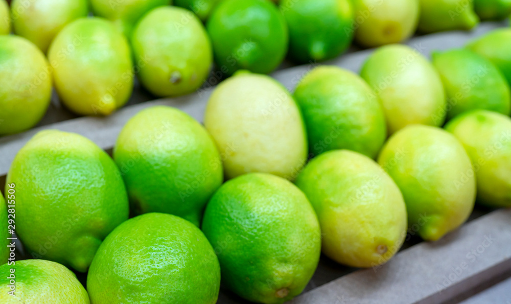 Ripe green lemons. Harvest of autumn in the store. Ripe green lemons. Harvest of autumn in the store.