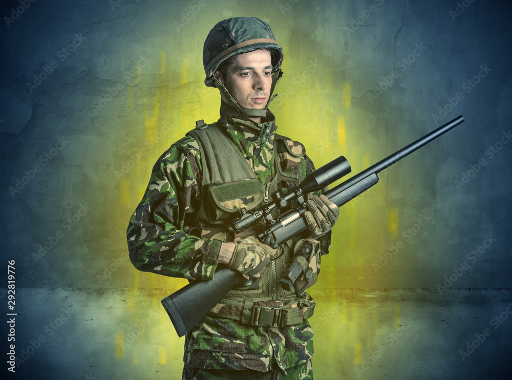 Hazard, menace soldier in a ruined crumbly building with arms on his hand Hazard, menace soldier in a ruined crumbly building with arms on his hand
