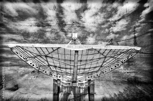 Radiotelescope focus to the sky in grunge style