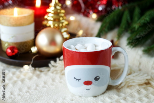 christmas background in gold and red colors decorations and cup of coffee wit...