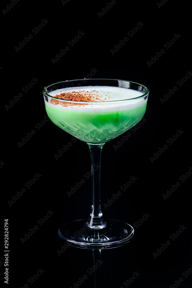 classic grasshopper cocktail with reflection on a dark background