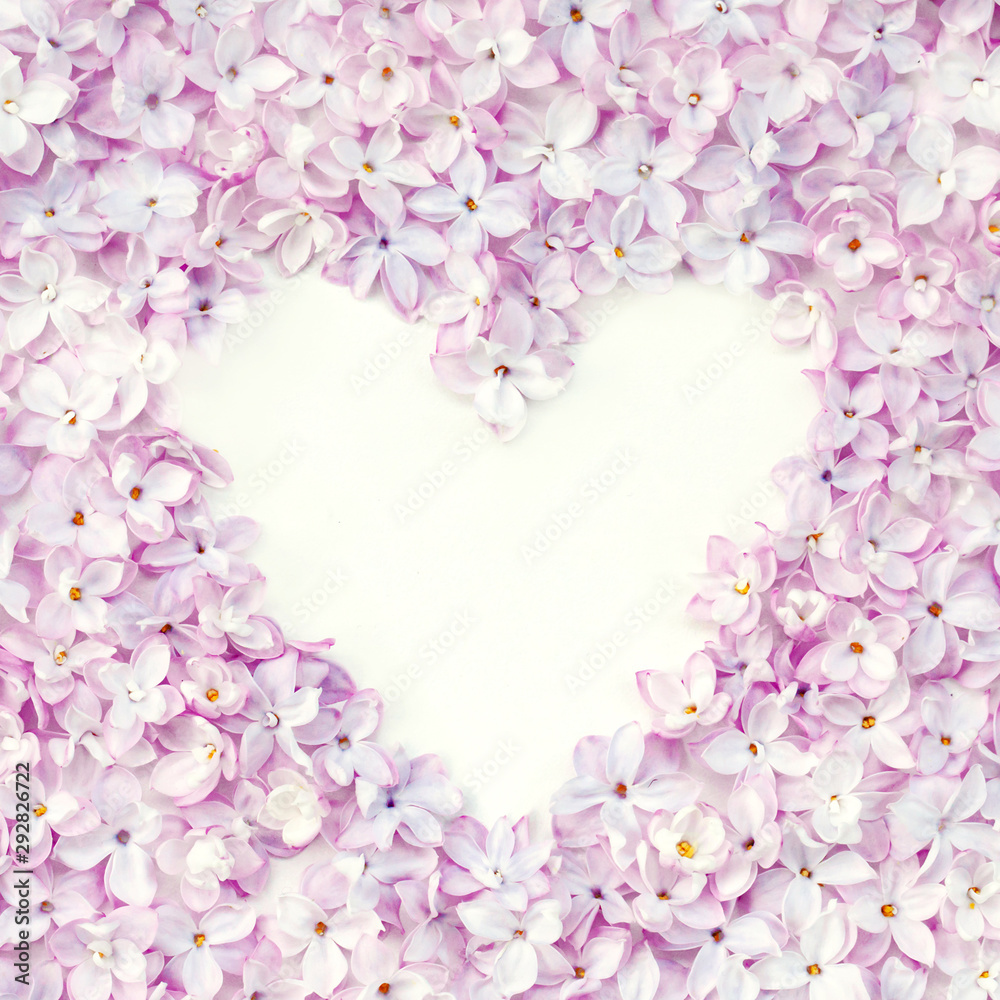 Lilac flowerheads heart shape frame. Floral beautiful border with copyspace.