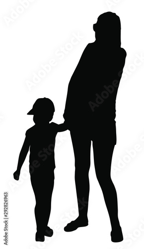 Silhouette of mother with kid walking