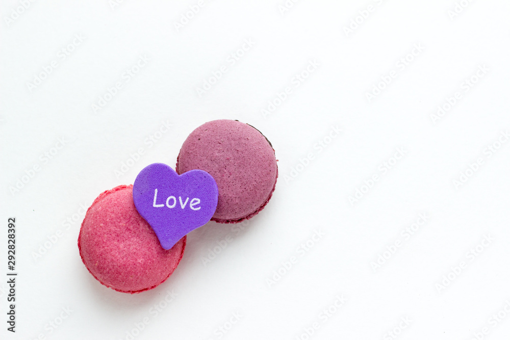 French Pink Macaroons on White Background. Top View Traditional Dessert for Feminine Design. Confectionery, Fashion, Beauty Advertising Template. French Pink Macaroons on White Background. Top View Traditional Dessert for Feminine Design. Confectionery, Fashion, Beauty Advertising Template.