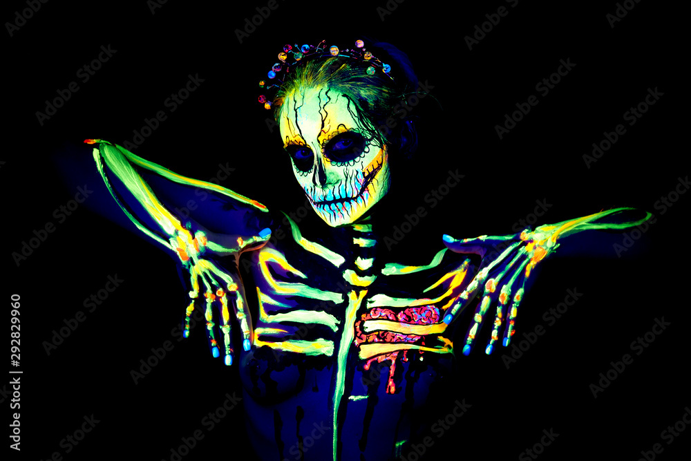 Foto Stock UV body art painting of helloween female skeleton | Adobe Stock