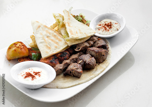 lebanese meshwi mixed grilled meat set on plate photo