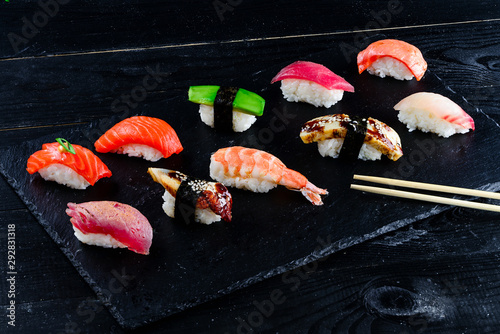 sushi set nigiri on a black background