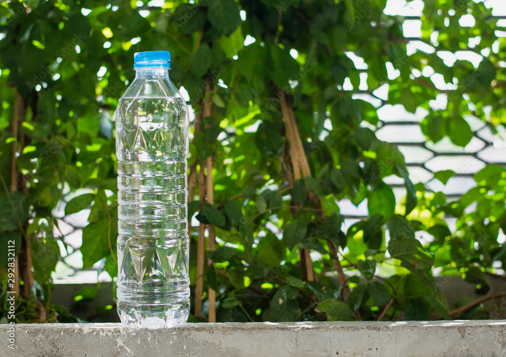 Drinking water bottle in garden,selective focus. Drinking water bottle in garden,selective focus.