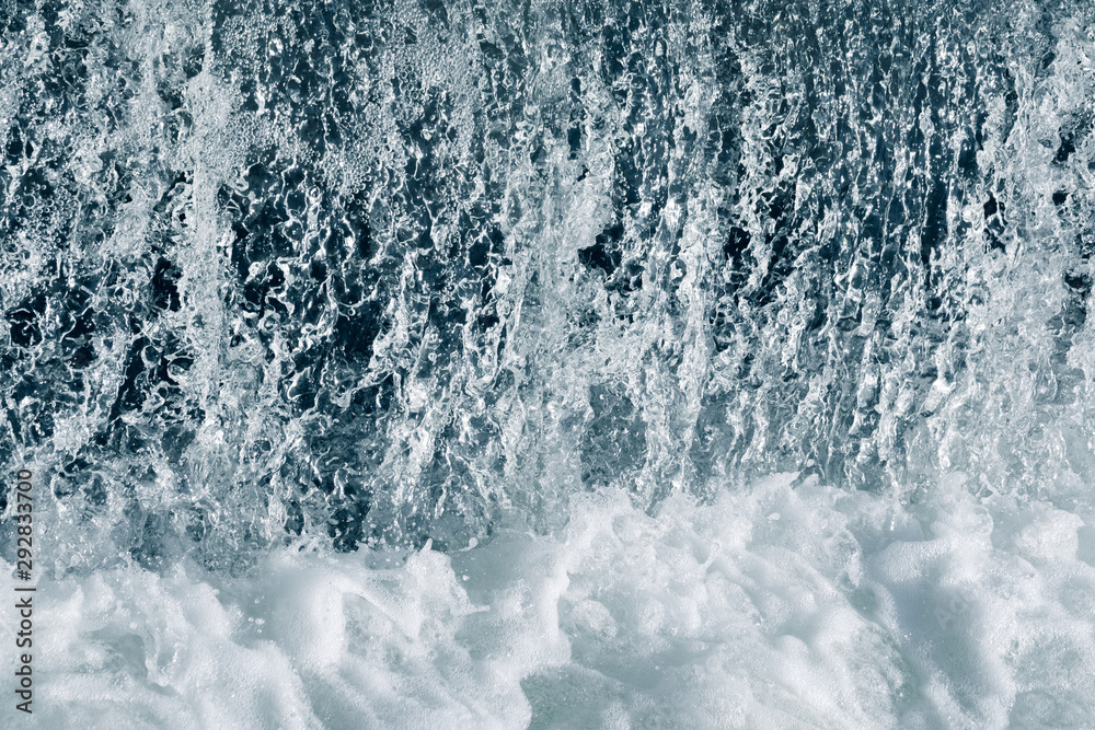 Blue and turquoise water with irregular wave structure