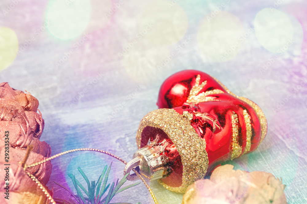Fototapeta premium Christmas or New Year concept, pine branch with toys, defocused multicolor Christmas lights