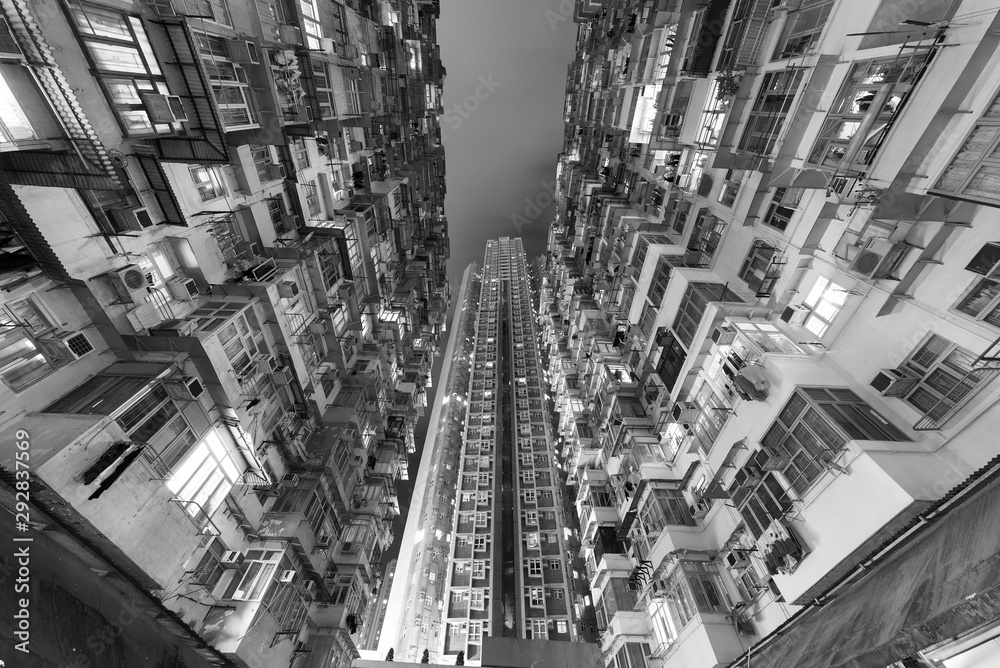 Old and new residential buildings in Hong Kong city at night