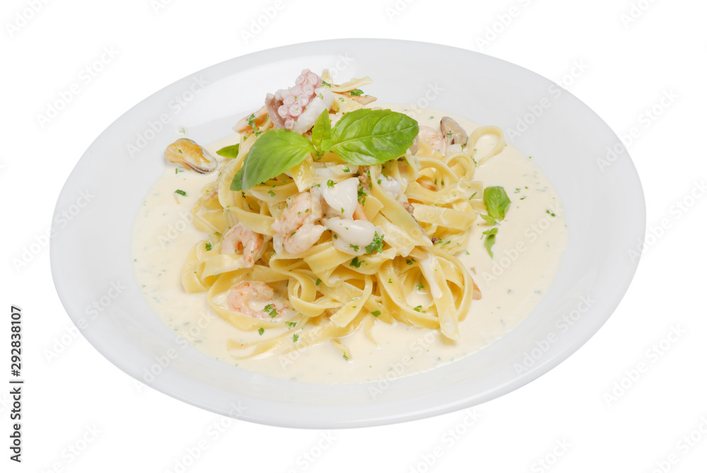 Fettuccine pasta with shrimp, tomatoes and herbs on a white isolated background Fettuccine pasta with shrimp, tomatoes and herbs on a white isolated background