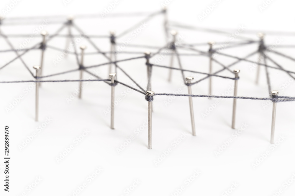 A large grid of pins connected with string. Communication, netwA large grid of pins connected with string. Communication, network conceptork concept A large grid of pins connected with string. Communication, netwA large grid of pins connected with string. Communication, network conceptork concept