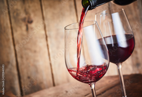 Serving two glasses of red wine with copy space