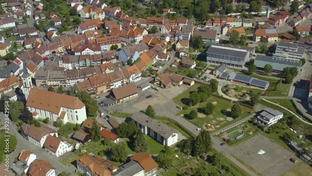 Aerial view of the city Löffingen in Germany in the black forest on a sunny day in summer. Wide view with pan to the right beside the old town. Aerial view of the city Löffingen in Germany in the black forest on a sunny day in summer. Wide view with pan to the right beside the old town.