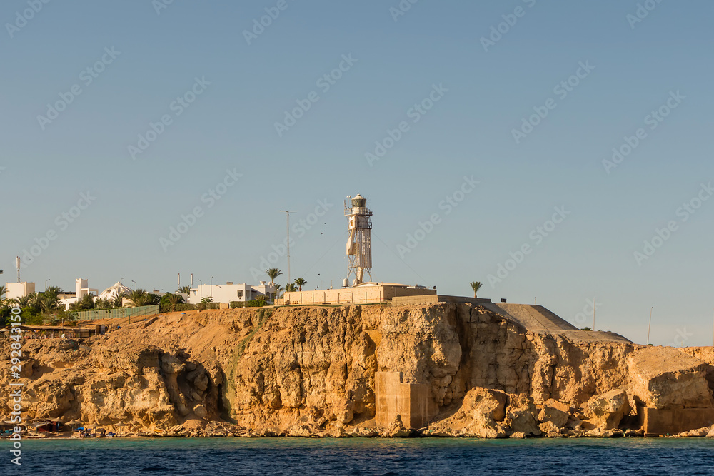 Lighthouse coast rock sea view