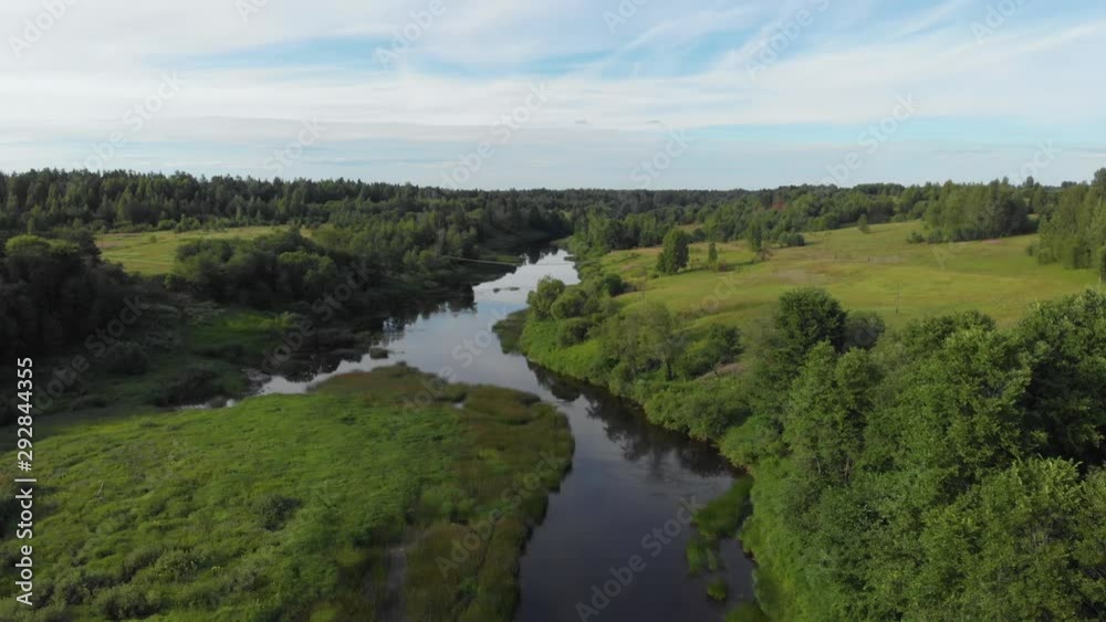 Suspended bridge remote Russian river with green island high angle aerial