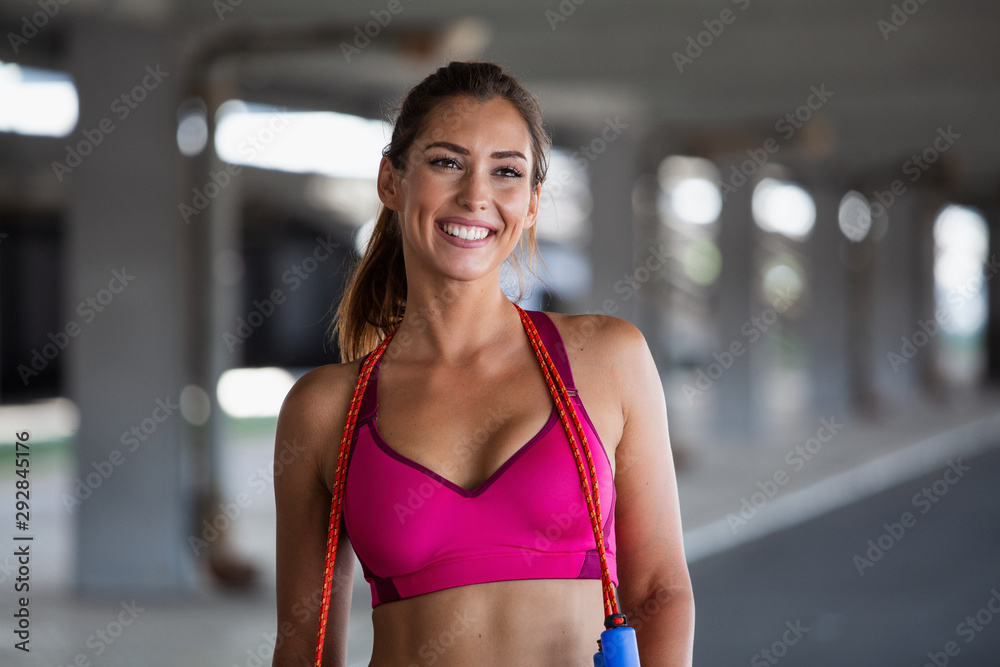 Portrait of Athletic young woman in sports dress doing fitness exercise.  Fitness woman streching Relaxing after training Healthy sports lifestyle.  Stock Photo | Adobe Stock