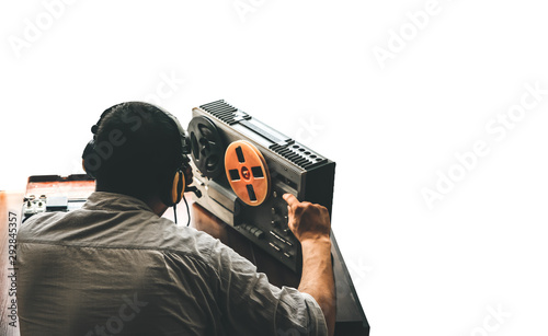 Obraz na plátně Special agent listens on the reel tape recorder