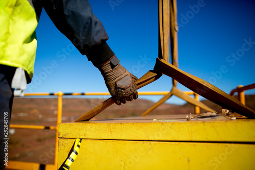 Photos Rigger hand construction worker wearing heavy duty glove holding safety control