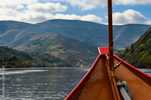 Scenic view of the Douro River and the Douro Valley from a rabelo boat, in Portugal; Concept for travel in Portugal and most beautiful places in Portugal photo