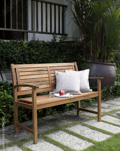 The wood bench in the backyard.