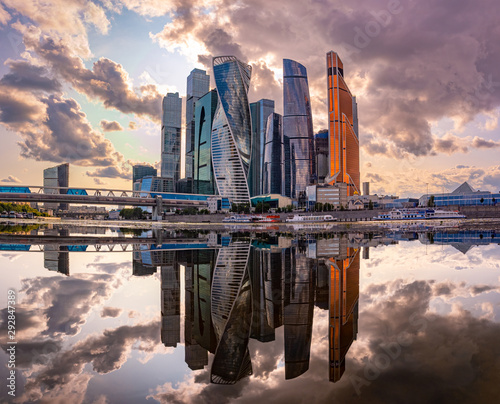 Moscow. Russia. Moscow-city. Skyscrapers against the clouds. Tall buildings are reflected in the water. Modern urban architecture. Business centre. Towers of glass and concrete. Urban landscape.
