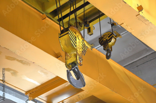 Big industrial iron hook for lifting and moving parts in the repair shop