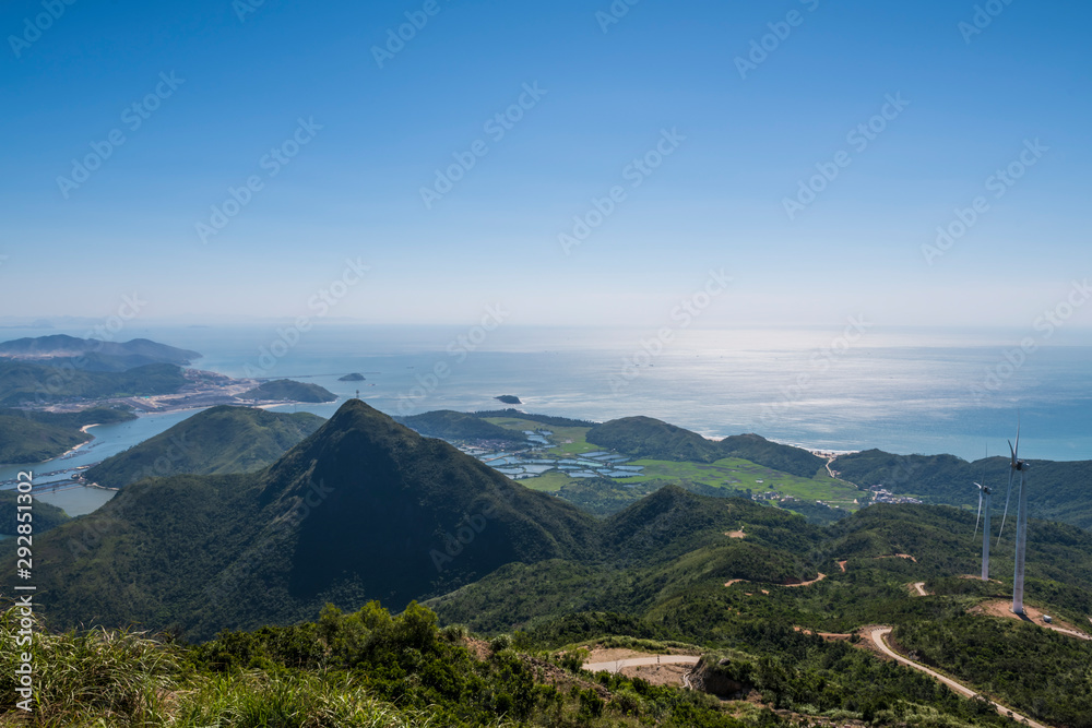 Looking at the scenery of the sea on the mountain Looking at the scenery of the sea on the mountain
