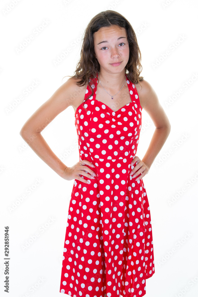 Unhappy dissatisfied young woman in red summer dress standing teen girl feels disappointed isolated over white background Unhappy dissatisfied young woman in red summer dress standing teen girl feels disappointed isolated over white background