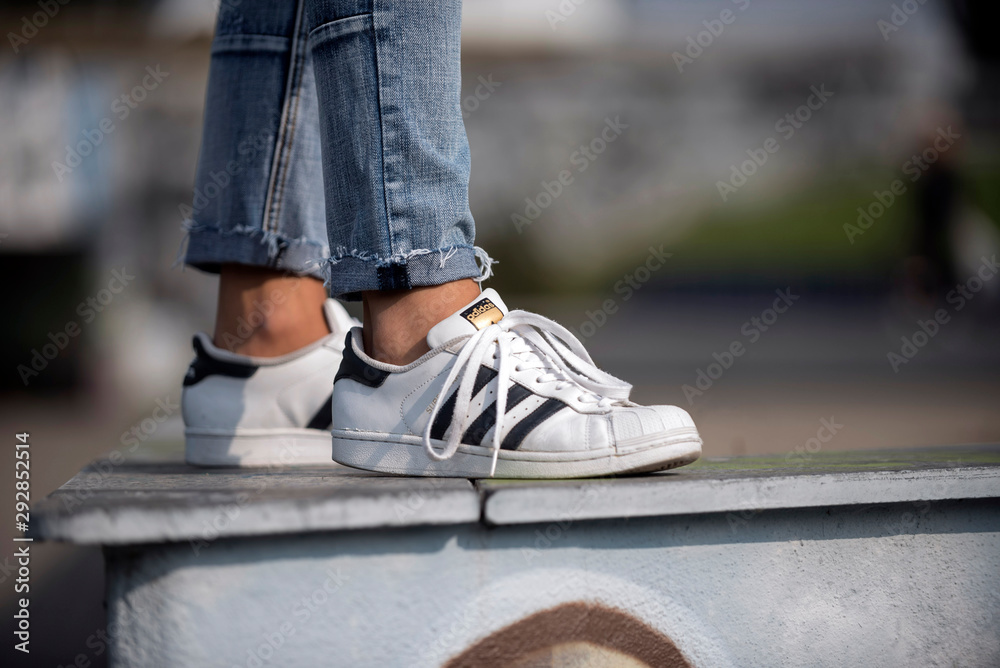 desnudo lago Económico Milan, Italy - September 28, 2017: Adidas Superstar shoes in the street -  illustrative editorial Stock Photo | Adobe Stock