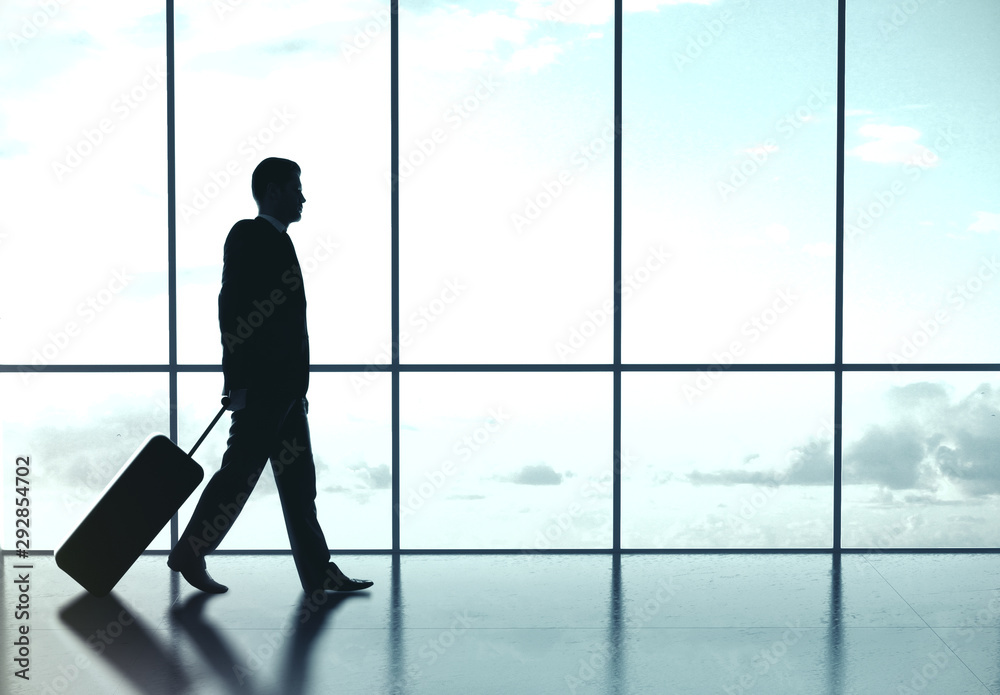 Businessman walking at airport Businessman walking at airport