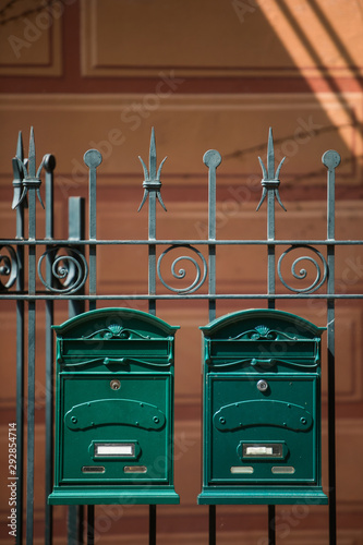 Two vintage green mail boxes photo