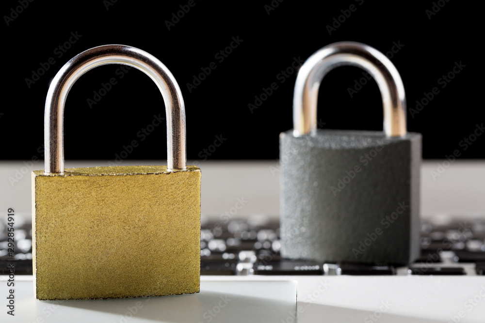 Fototapeta premium Padlocks on laptop. Internet data privacy information security concept. Antivirus and malware multilayer defense.