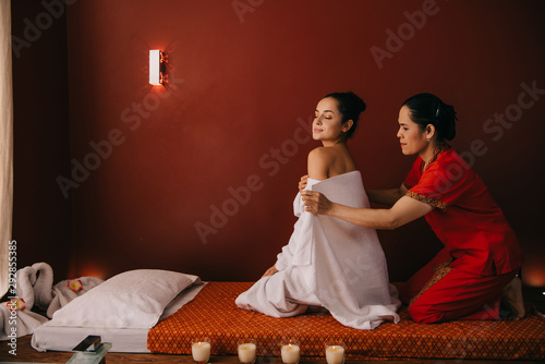asian woman wrapping with towel attractive woman in spa salon