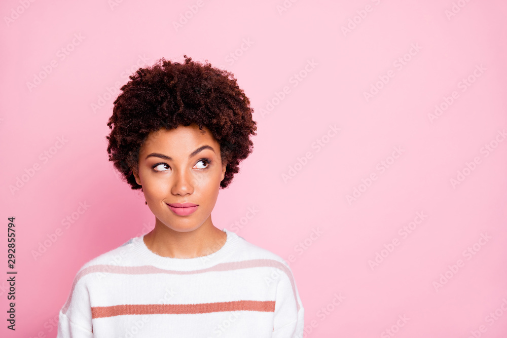 Photo of curious sly black skinned girl glancing at empty space wearing striped white sweater planning her life isolated over pink pastel color background Photo of curious sly black skinned girl glancing at empty space wearing striped white sweater planning her life isolated over pink pastel color background