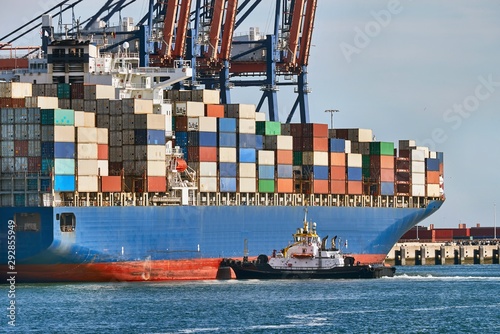 Huge container ship in port being loaded