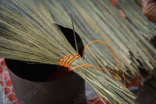 close up hand made brooms grass thailand broom photo