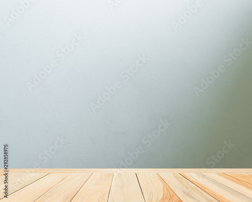 Empty Gray wooden floor perspective and empty dark loft cement wall room interiors background with soft light,well use editing display your product or text present on free space background vintage