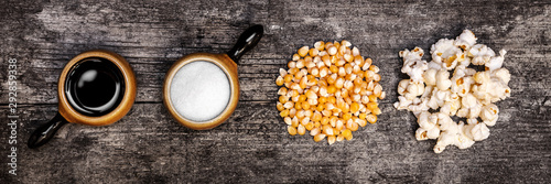 Banner, fresh sweet popcorn ingredients on wooden table photo
