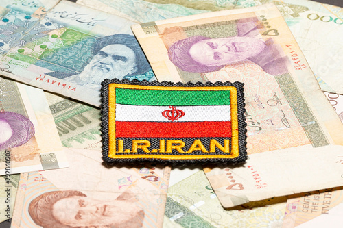 Iranian flag with Iranian money depicting Ruhollah Khomeini photo