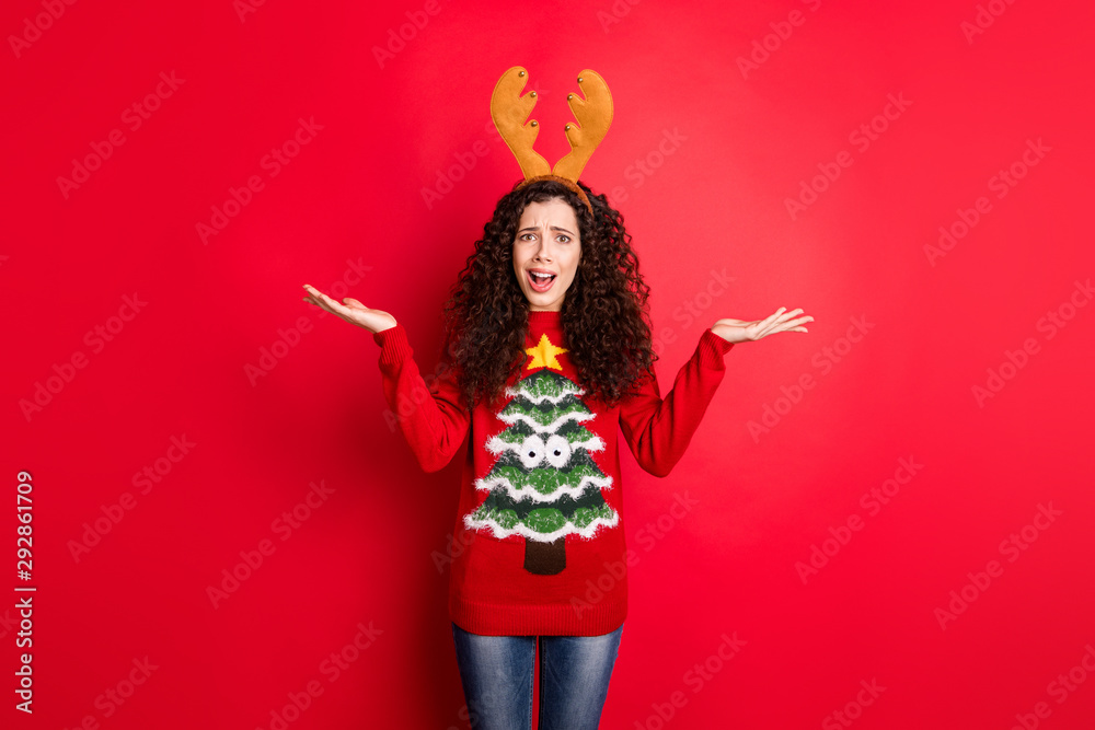 Photo of pretty wavy lady not satisfied with santa's deer role in costume party wear head horns knitted funny pullover isolated red color background